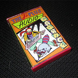 front of Audio Garbage cassette case, on black