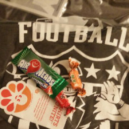 a bag with a jersey and some candy
