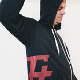 Lifting up arm to show logo on side