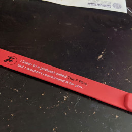 a slap bracelet on a black table