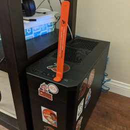 slap bracelet sticking out of computer