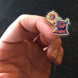 7 stump stickers sit in an adult male hand